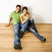 Couple on new hardwood floor