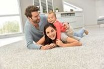 Family playing on new carpet